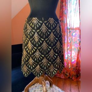 Art Deco sequin skirt, scalloped edge.